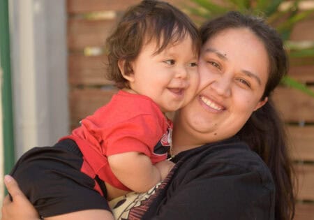 mother hugging child
