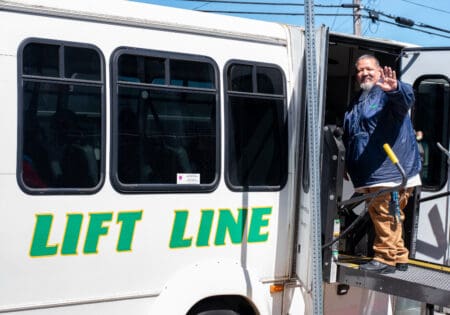 Lift Line driver waving as they enter van