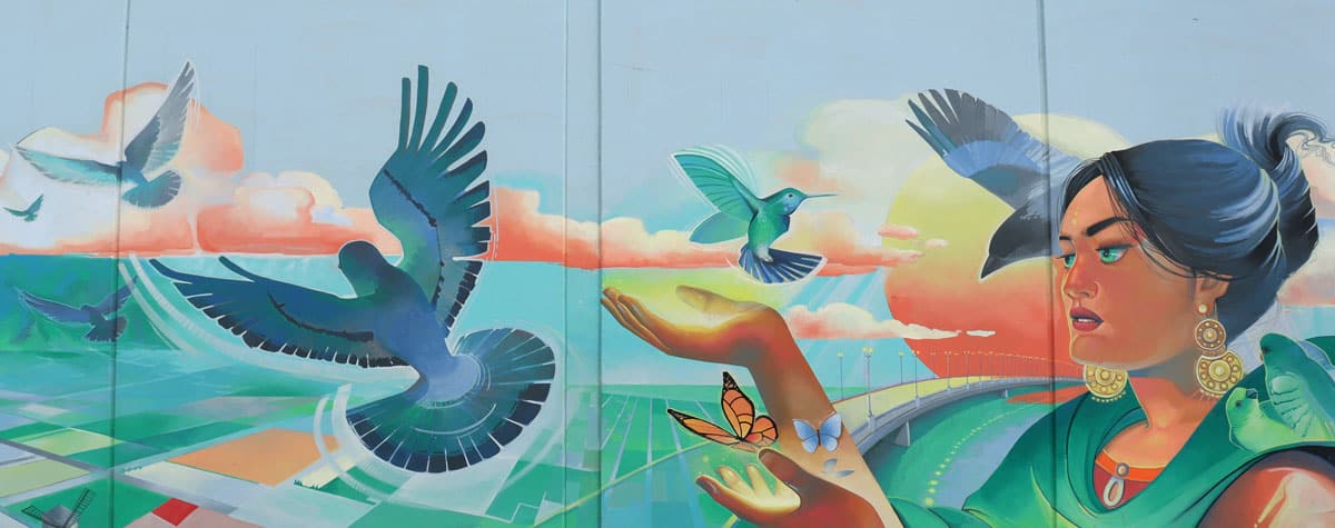 woman with butterflies and birds mural