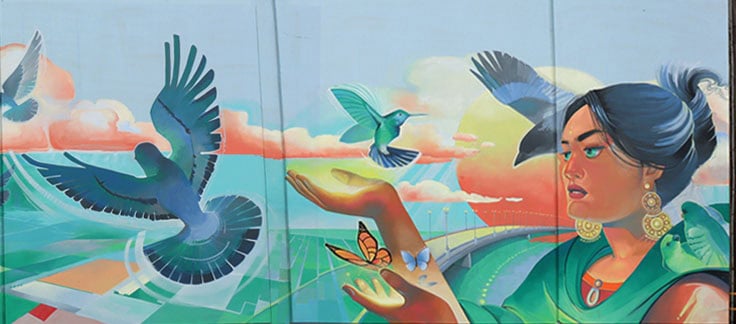 woman with butterflies and birds mural